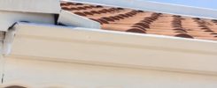 a close up of a roof with a sky background